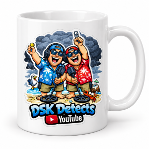 White DSK Detects mug displaying the colourful cartoon detectorists logo — product mockup